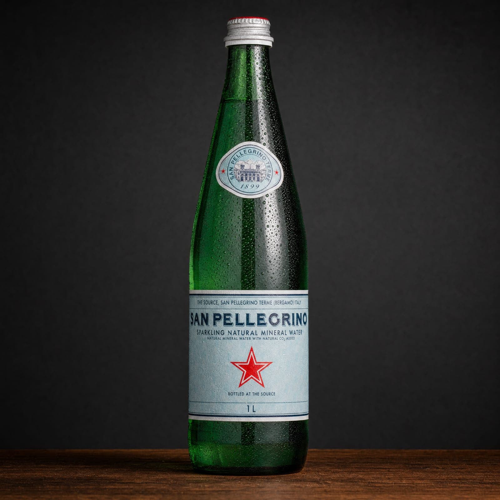 San Pellegrino, a green glass bottle of San Pellegrino sparkling water